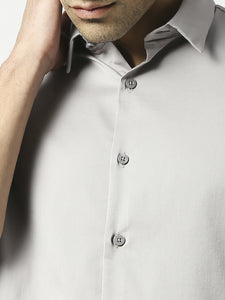 Grey cotton satin lycra solid shirt with full sleeves and a stich-less collar.